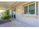 Comfortable covered patio with bar overlooking the backyard at 11133 W Cameo Dr, Sun City, AZ 85351