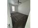 A light, airy bedroom with a ceiling fan and patterned carpeting at 11596 W Sierra Dawn Blvd # 372, Surprise, AZ 85378