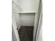 A walk-in closet has carpet and white wire shelving for optimal storage at 11596 W Sierra Dawn Blvd # 372, Surprise, AZ 85378