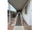 View of an accessible home entrance featuring a ramp and carport at 11596 W Sierra Dawn Blvd # 372, Surprise, AZ 85378