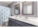 Bathroom features double sinks, framed mirrors, and a shower-tub combination at 11622 W Palm Brook Dr, Avondale, AZ 85392