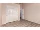Neutral bedroom features tile flooring and a closet with sliding doors at 11622 W Palm Brook Dr, Avondale, AZ 85392
