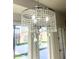 Close up of a stunning chandelier with crystal accents that enhance a space at 11622 W Palm Brook Dr, Avondale, AZ 85392