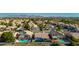 Aerial view of a quiet residential community with lush landscaping and mountain views at 11622 W Palm Brook Dr, Avondale, AZ 85392
