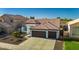 Beautiful single-Gathering home featuring a three car garage and well-maintained landscaping at 11622 W Palm Brook Dr, Avondale, AZ 85392
