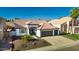 Charming home featuring a well-manicured front yard, mature landscaping, and a spacious driveway at 11622 W Palm Brook Dr, Avondale, AZ 85392