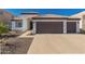Charming single-story home features a well-manicured front yard and a spacious two-car garage at 11622 W Palm Brook Dr, Avondale, AZ 85392