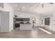 Bright open-concept living space and modern kitchen featuring a large island with stainless appliances at 11622 W Palm Brook Dr, Avondale, AZ 85392