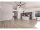 Bright and spacious open-concept living space with modern kitchen featuring a large island at 11622 W Palm Brook Dr, Avondale, AZ 85392