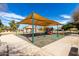 Well-maintained playground with swings, slides, and a covered play area, providing a safe and enjoyable space for  at 11622 W Palm Brook Dr, Avondale, AZ 85392