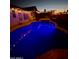 Outdoor view of pool, spa, and covered patio, perfect for relaxing at the end of the day at 11622 W Palm Brook Dr, Avondale, AZ 85392