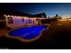 An inviting backyard with string lights over a shimmering pool creates the perfect ambiance at 11622 W Palm Brook Dr, Avondale, AZ 85392