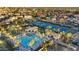 Aerial view highlighting the community pool, tennis courts, and manicured landscaping at 11816 E Terra Dr, Scottsdale, AZ 85259