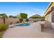 Backyard showcasing a custom pool, built-in barbecue, and patio area for ultimate outdoor enjoyment at 11816 E Terra Dr, Scottsdale, AZ 85259