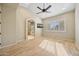 Airy bedroom with a ceiling fan, walk-in closet and access to a private bathroom at 11816 E Terra Dr, Scottsdale, AZ 85259
