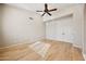 Bright bedroom with hardwood floors, closet and a ceiling fan at 11816 E Terra Dr, Scottsdale, AZ 85259