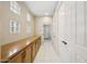 Hallway with built-in storage cabinets and access to other rooms at 11816 E Terra Dr, Scottsdale, AZ 85259