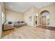 Bright living room features a soaring ceiling, blonde wood flooring and modern furniture at 11816 E Terra Dr, Scottsdale, AZ 85259