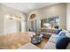 Bright living area boasts hardwood floors, a neutral color palette and backyard access at 11816 E Terra Dr, Scottsdale, AZ 85259