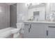 Modern bathroom with gray tiling in shower, and neutral color palette at 13012 N 36Th Dr, Phoenix, AZ 85029