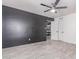 A bedroom featuring an accent wall, doors, and light gray flooring at 13012 N 36Th Dr, Phoenix, AZ 85029
