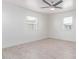 Bright bedroom features white walls and two windows at 13012 N 36Th Dr, Phoenix, AZ 85029