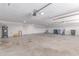 Spacious garage features ample storage and a concrete floor at 13012 N 36Th Dr, Phoenix, AZ 85029