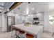 Bright kitchen features gray cabinets, stainless appliances, and a large center island with seating at 13012 N 36Th Dr, Phoenix, AZ 85029