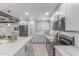 Bright kitchen features gray cabinets, stainless appliances, subway tile backsplash, and a large center island at 13012 N 36Th Dr, Phoenix, AZ 85029