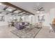 Bright and airy living room and dining room with wood beam accents and neutral decor at 13012 N 36Th Dr, Phoenix, AZ 85029