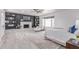 Main bedroom features a brick fireplace, built-in shelving, ceiling fan, and a large window at 13012 N 36Th Dr, Phoenix, AZ 85029