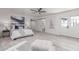 Bright main bedroom features light walls, a ceiling fan, and modern decor at 13012 N 36Th Dr, Phoenix, AZ 85029