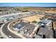 An aerial view showcases new homes with desert surroundings, block wall fences, and some with a private pool at 13619 W Hackamore Dr, Peoria, AZ 85383