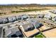 Aerial view of new homes in a desert environment, featuring block wall fences and some desert landscaping at 13619 W Hackamore Dr, Peoria, AZ 85383
