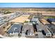 Establishing neighborhood aerial view, showing multiple rooftops and wide-open spaces at 13619 W Hackamore Dr, Peoria, AZ 85383
