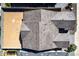 Drone's eye view of patterned roof tiles, block wall backyard and trees at 13619 W Hackamore Dr, Peoria, AZ 85383
