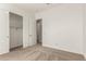 Bedroom featuring neutral carpet, white walls, and a closet with sliding doors at 13619 W Hackamore Dr, Peoria, AZ 85383