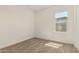 A bright bedroom with neutral carpet and a window looking to the outside at 13619 W Hackamore Dr, Peoria, AZ 85383