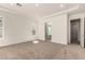 Spacious bedroom featuring neutral carpet, a tray ceiling, and natural light at 13619 W Hackamore Dr, Peoria, AZ 85383