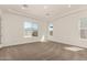 Bright, carpeted bedroom featuring recessed lighting and large windows at 13619 W Hackamore Dr, Peoria, AZ 85383