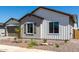 Close up of a home with a well maintained front yard, desert landscaping, and neutral toned exterior at 13619 W Hackamore Dr, Peoria, AZ 85383