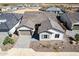 Aerial view of a charming home with a well-maintained front yard featuring desert landscaping at 13619 W Hackamore Dr, Peoria, AZ 85383