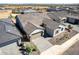 Aerial view of a charming house with a well-manicured front yard, lush lawn and neutral color palette at 13619 W Hackamore Dr, Peoria, AZ 85383