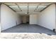 A clean, well lit, and spacious garage with automatic overhead door at 13619 W Hackamore Dr, Peoria, AZ 85383