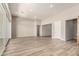 A bright, open-concept living room with tiled floors and a sliding glass door at 13619 W Hackamore Dr, Peoria, AZ 85383