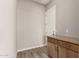 Mud room with built-in storage cabinets and wood-look flooring at 13619 W Hackamore Dr, Peoria, AZ 85383