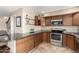 Well-equipped kitchen featuring stainless steel appliances, stylish cabinetry, and sleek granite countertops at 1401 E Puget Ave # 10, Phoenix, AZ 85020