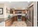 Contemporary kitchen displays stainless steel appliances, granite counters, and tile flooring at 1401 E Puget Ave # 10, Phoenix, AZ 85020