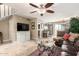 Spacious living room features tile floors, a ceiling fan, and an open layout at 1401 E Puget Ave # 10, Phoenix, AZ 85020
