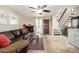 Cozy living room showcasing tile flooring, fireplace, and easy access to the staircase at 1401 E Puget Ave # 10, Phoenix, AZ 85020